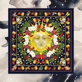 Decorative scarf with a sun and floral design on a dark background